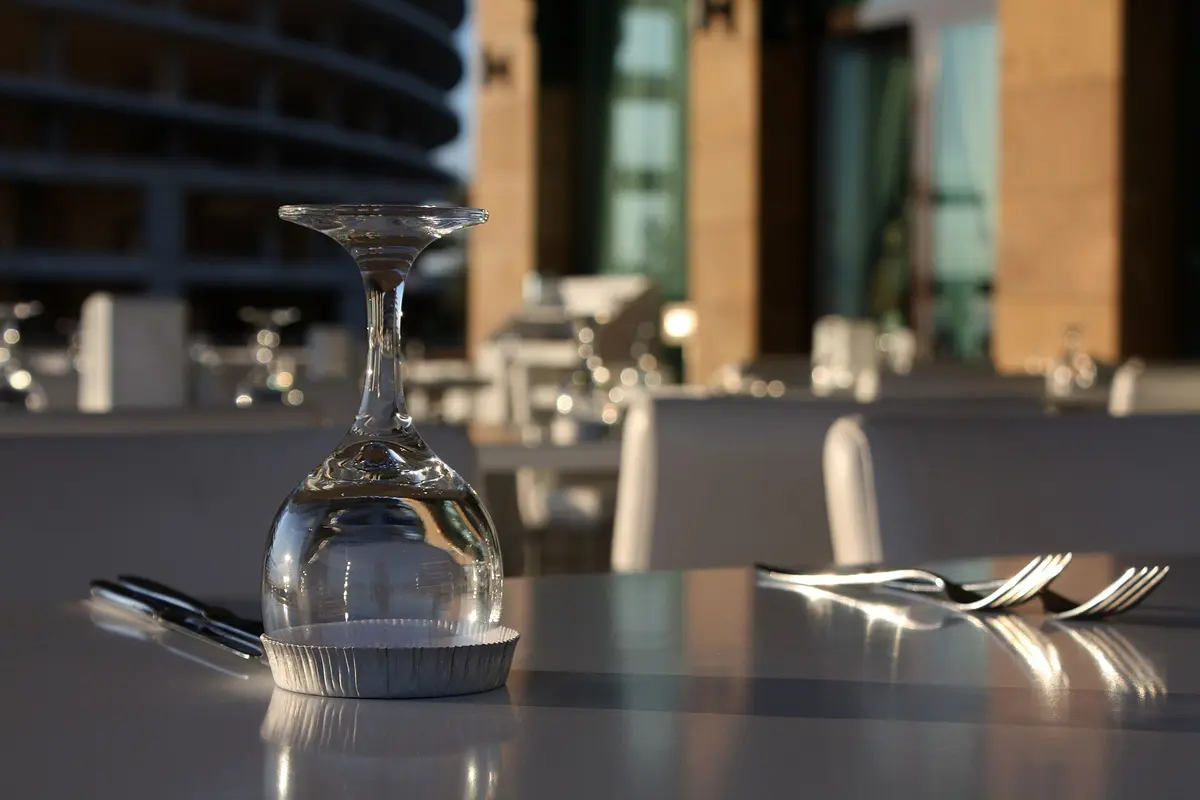 A table set for dinner by a window