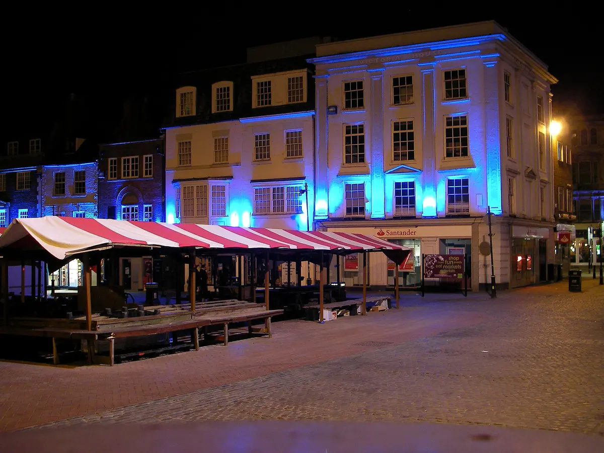 The buildings around Northampton's Market Square lit at night